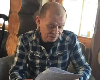 picture of a man reading a booklet